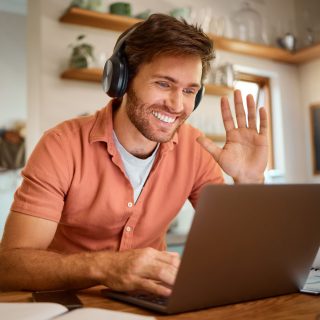 Wave, laptop and online meeting with man in kitchen for video ca